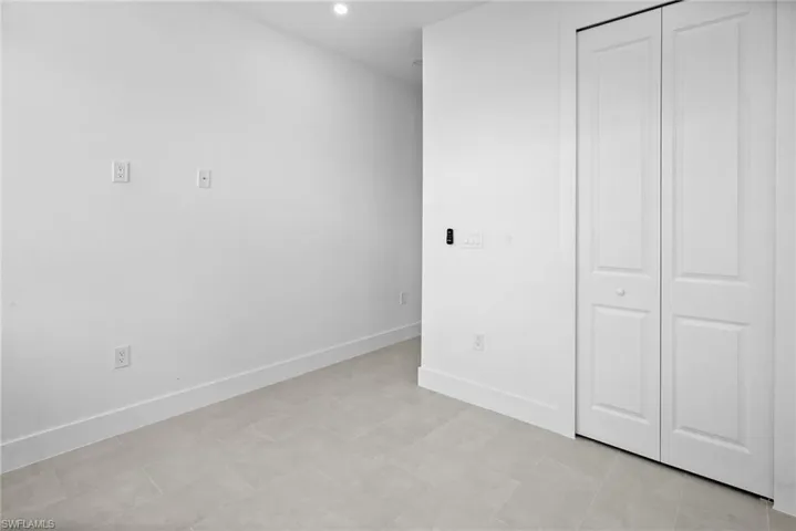 Unfurnished bedroom featuring a closet and recessed lighting