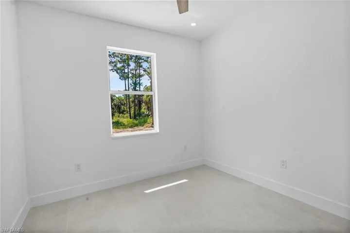 Empty room featuring recessed lighting and ceiling fan