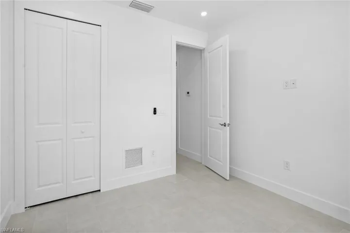 Unfurnished bedroom featuring a closet and recessed lighting