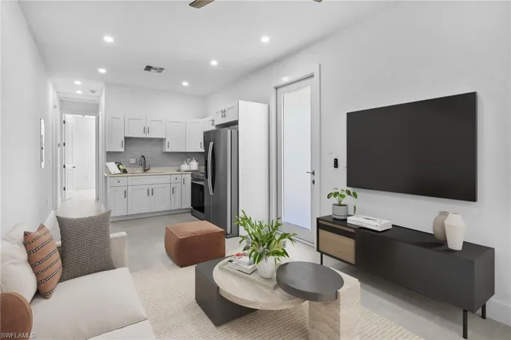 Living room featuring recessed lighting, a ceiling fan, and light tile patterned floors