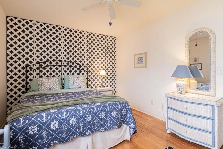 Bedroom featuring hardwood / wood-style flooring and ceiling fan