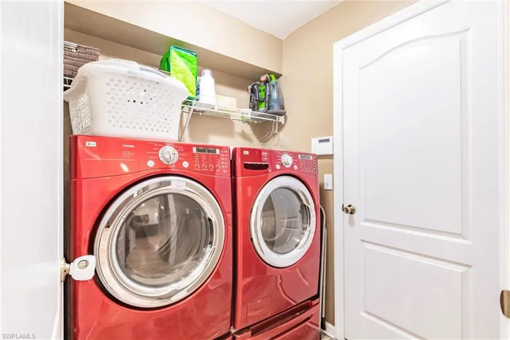 Laundry area featuring washing machine and clothes dryer