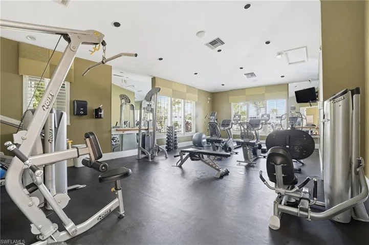Exercise room featuring recessed lighting