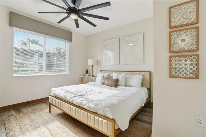 Bedroom featuring wood finished floors and a ceiling fan