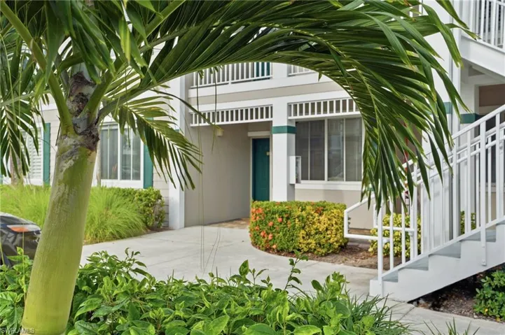 View of exterior entry with stucco siding
