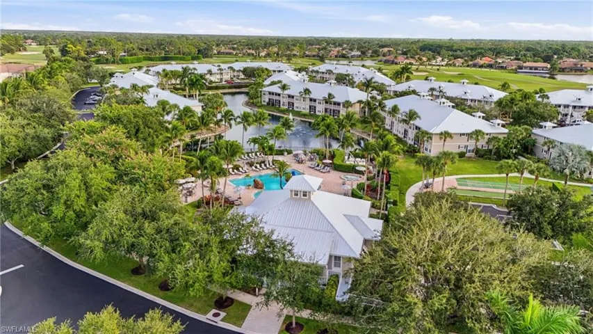 Aerial view of a pool area and a local golf course
