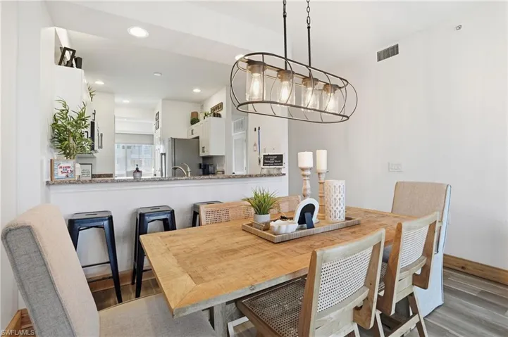 Dining space featuring light wood-type flooring and recessed lighting