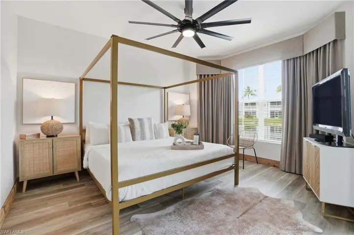 Bedroom featuring light wood-type flooring and ceiling fan