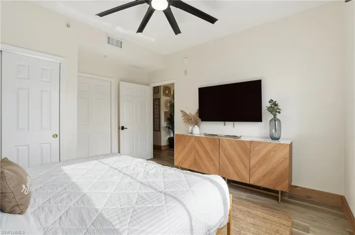 Bedroom featuring light wood-style flooring and a ceiling fan