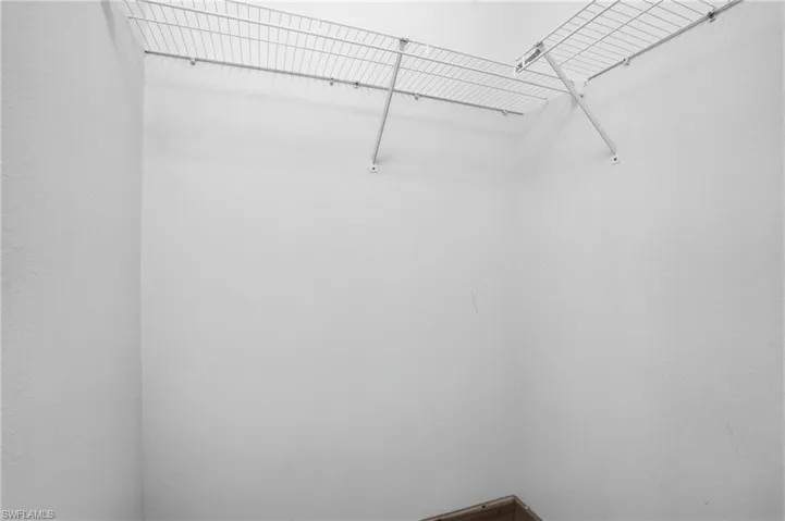 View of walk in closet (1 of 2 in master)
