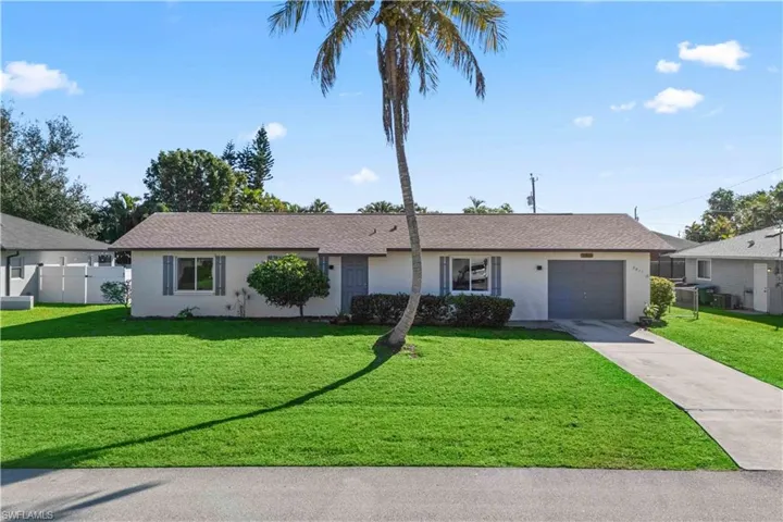 Single story home featuring stucco siding, concrete driveway, and a garage