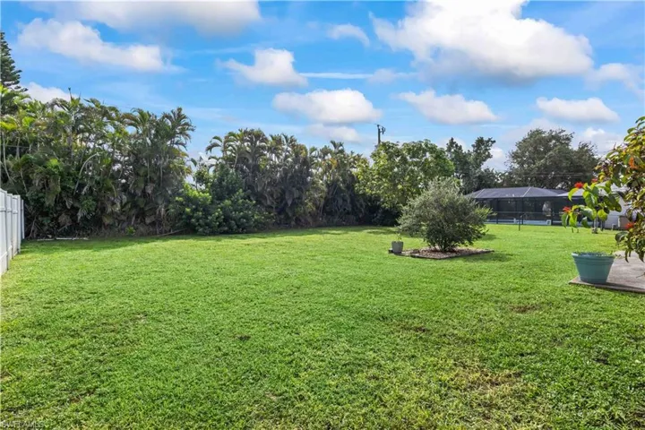View of yard with a sunroom