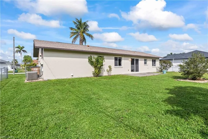 Rear view of house featuring a patio area and stucco siding