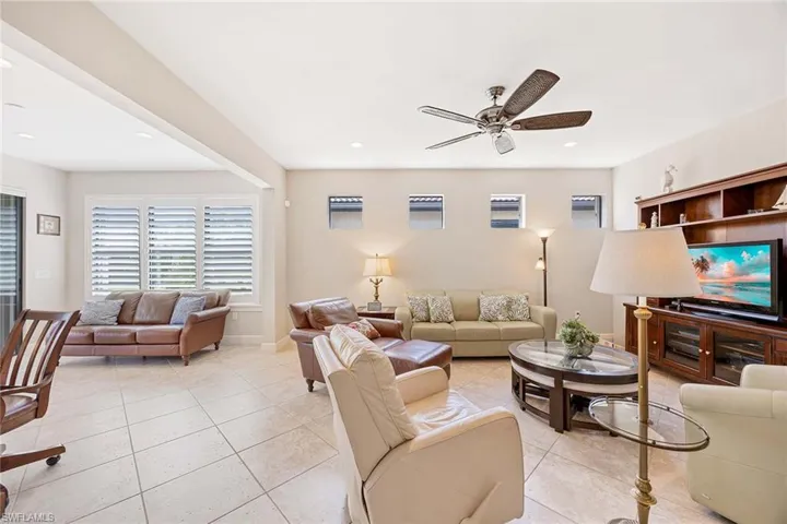Living Room, manual hurricane shutters on all the windows!