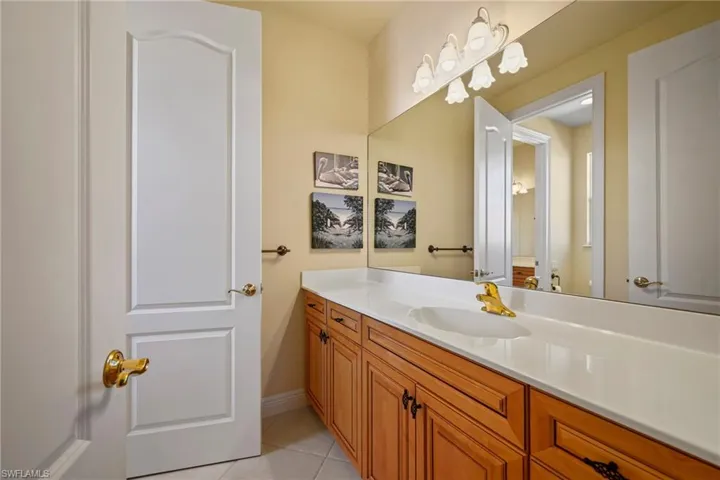 Bathroom featuring vanity and light tile patterned floors