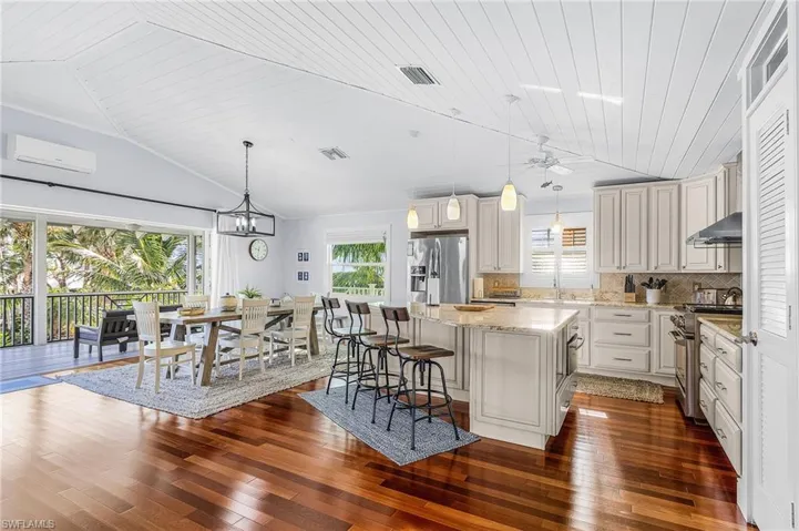 The custom kitchen, wood ceilings, and solid mahogany floors give this home a true "Old Southern Florida" charm.