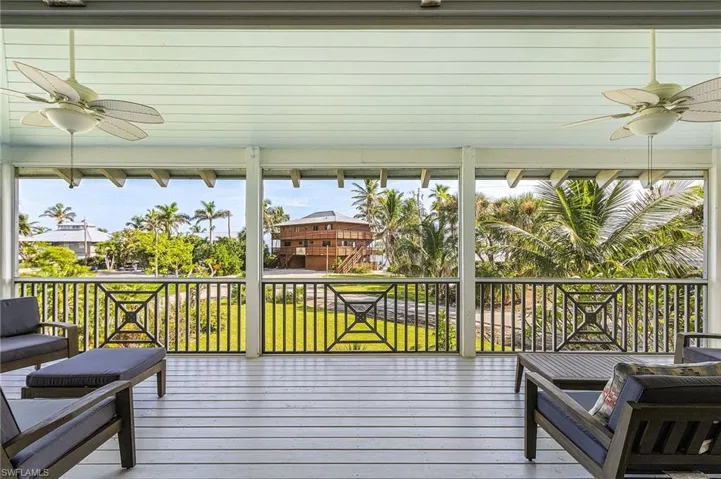 The large screened deck upstairs has plenty of room for relaxing and enjoying the boat in Charlotte Harbor.