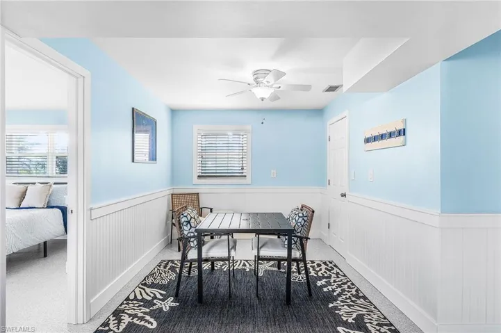 This downstairs retreat has an area for eating or for card playing.