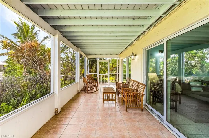 Private Screen Porch for the downstairs guest suite and overlooks Charlotte Harbor.