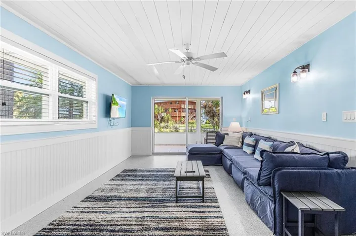 Downstairs guest Living Room with sliding doors leading to the private screen porch.