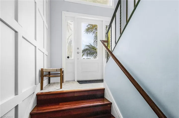 The entry leads to the upstairs living area, and also a downstairs private retreat for guests.