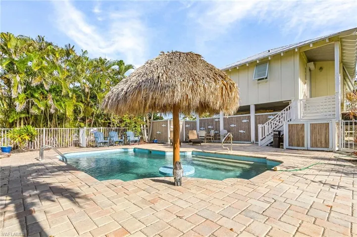 The pool has a unique bamboo fenced-in privacy screen.
