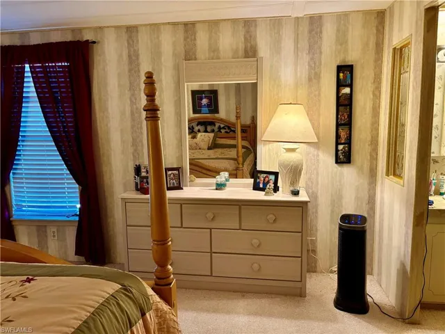 Bedroom with light carpet