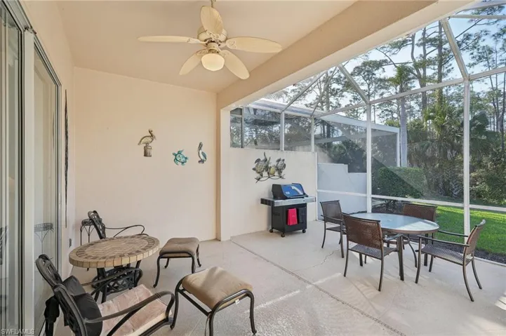Sunroom / solarium featuring a wealth of natural light and a ceiling fan