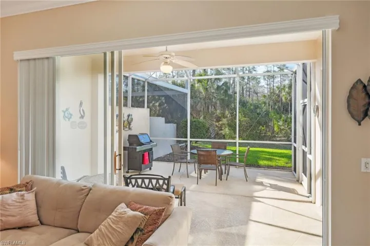 Sunroom / solarium with a ceiling fan