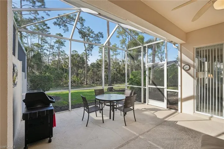 Sunroom featuring ceiling fan