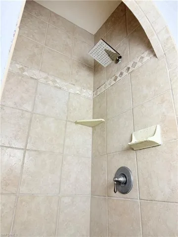 Details with a tile shower