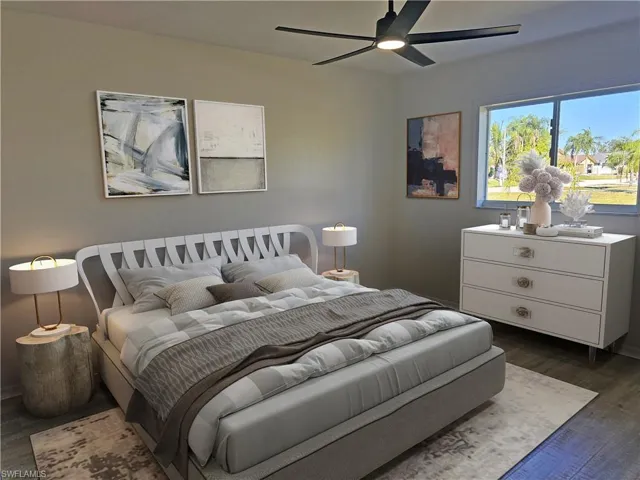 Bedroom featuring dark wood-style flooring and ceiling fan