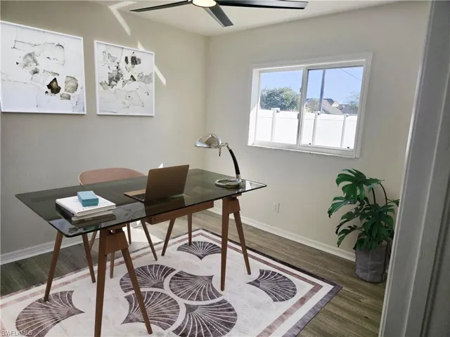 Office space featuring wood finished floors and a ceiling fan