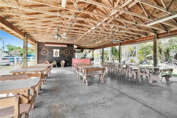 covered pavilion" "open-air barn" or "rustic reception hall".