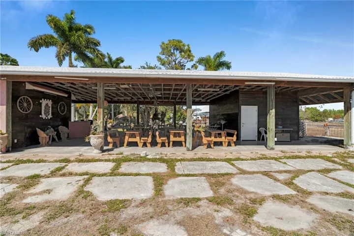 covered pavilion" "open-air barn" or "rustic reception hall".