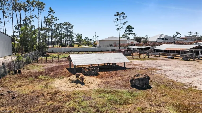 View of yard featuring an outbuilding and an exterior structure