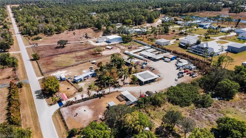 Aerial view of property's location featuring a forest