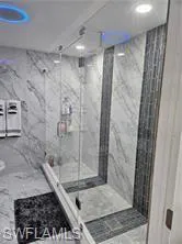 Bathroom featuring a shower with shower door