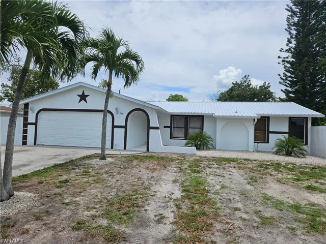 Single story home with a garage