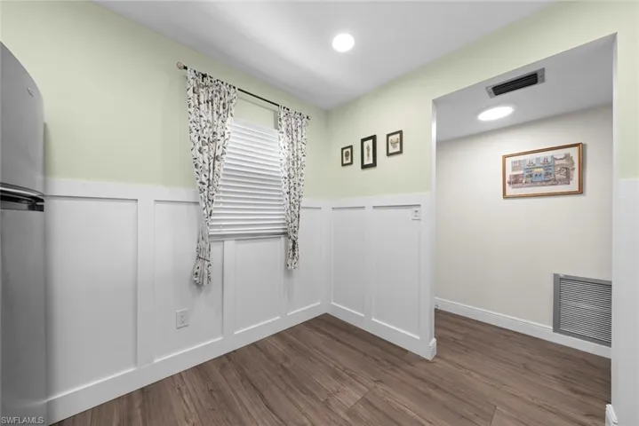 Another view of the kitchen and entryway