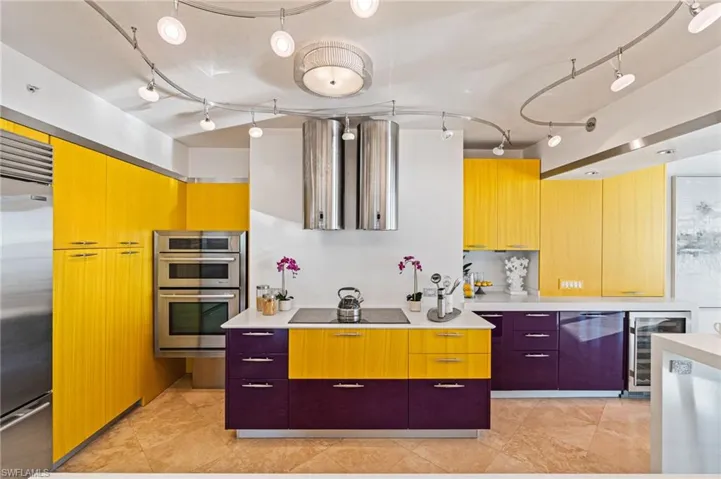 The chef's kitchen boasts dual Faber range hoods, Thermador cooktop, JennAir wall oven and microwave to name a few...