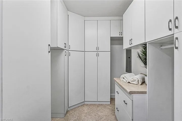 Laundry extension has a flex space for extra storage as utility, pantry or mudroom.