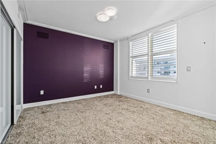 Bedroom #3 is spacious with a vibrant feature wall and tri-door walk-in closet along with a en suite full bathroom.