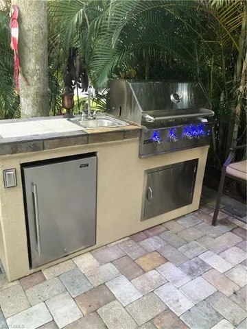 View of patio / terrace with area for grilling, sink, and grilling area