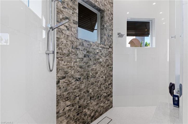 Glass Tile & Marble to ceiling in Shower