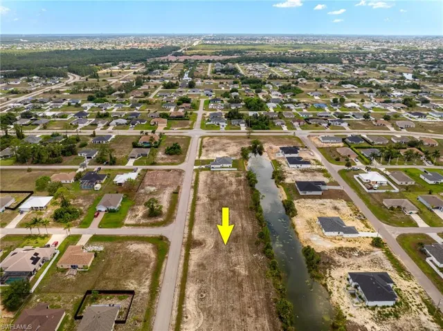 View of property location with nearby suburban area