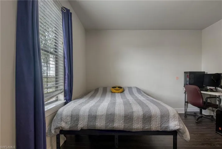 Bedroom featuring dark hardwood / wood-style flooring