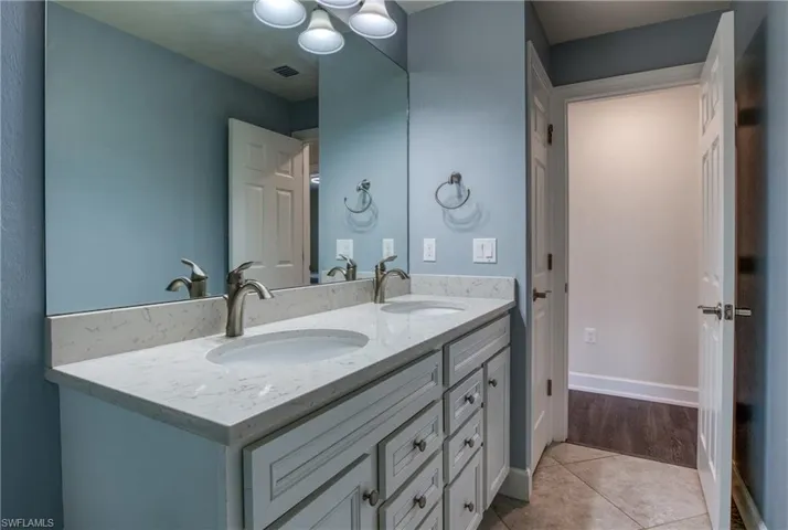 Bathroom featuring vanity and tile patterned flooring