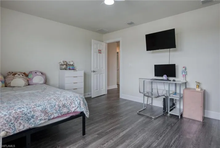 Bedroom featuring dark hardwood / wood-style floors