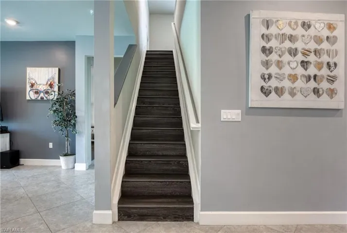Staircase featuring tile patterned flooring